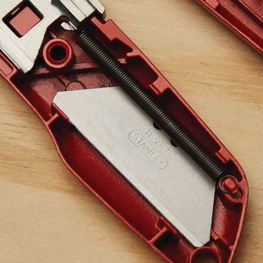 Closeup of Self retracting safety utility knife.